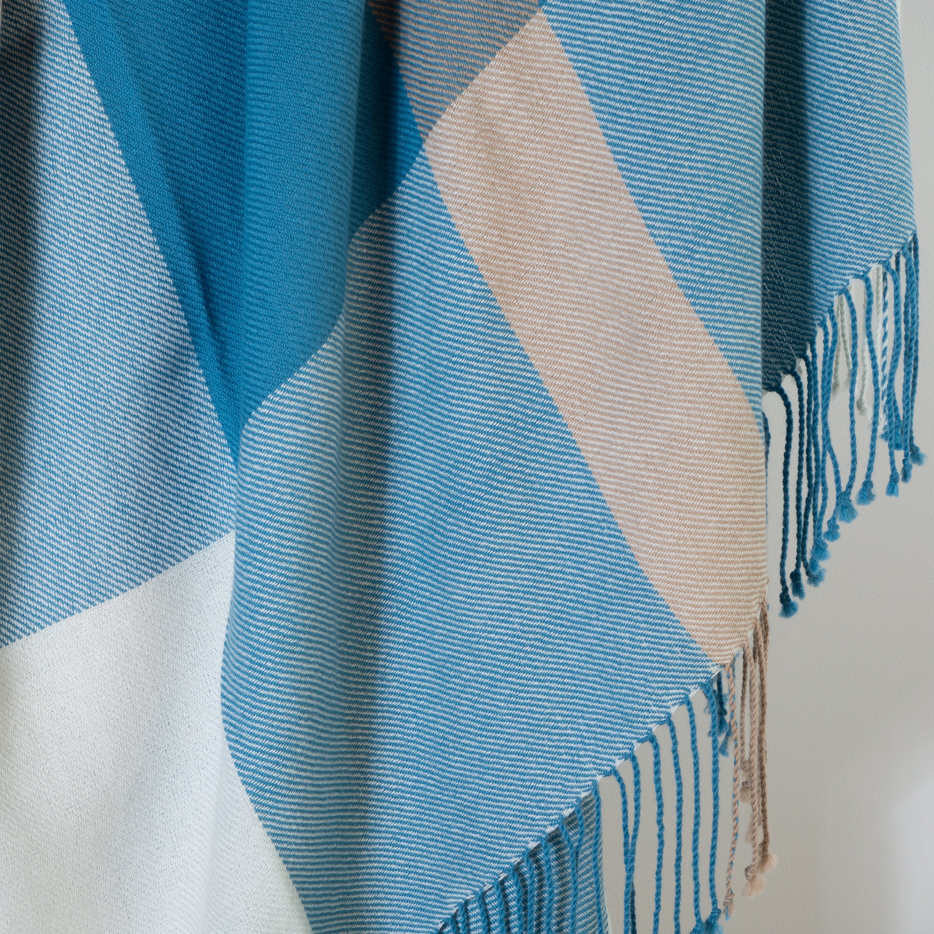 Handwoven aqua, light brown and white baby alpaca throw blanket from Peru up close