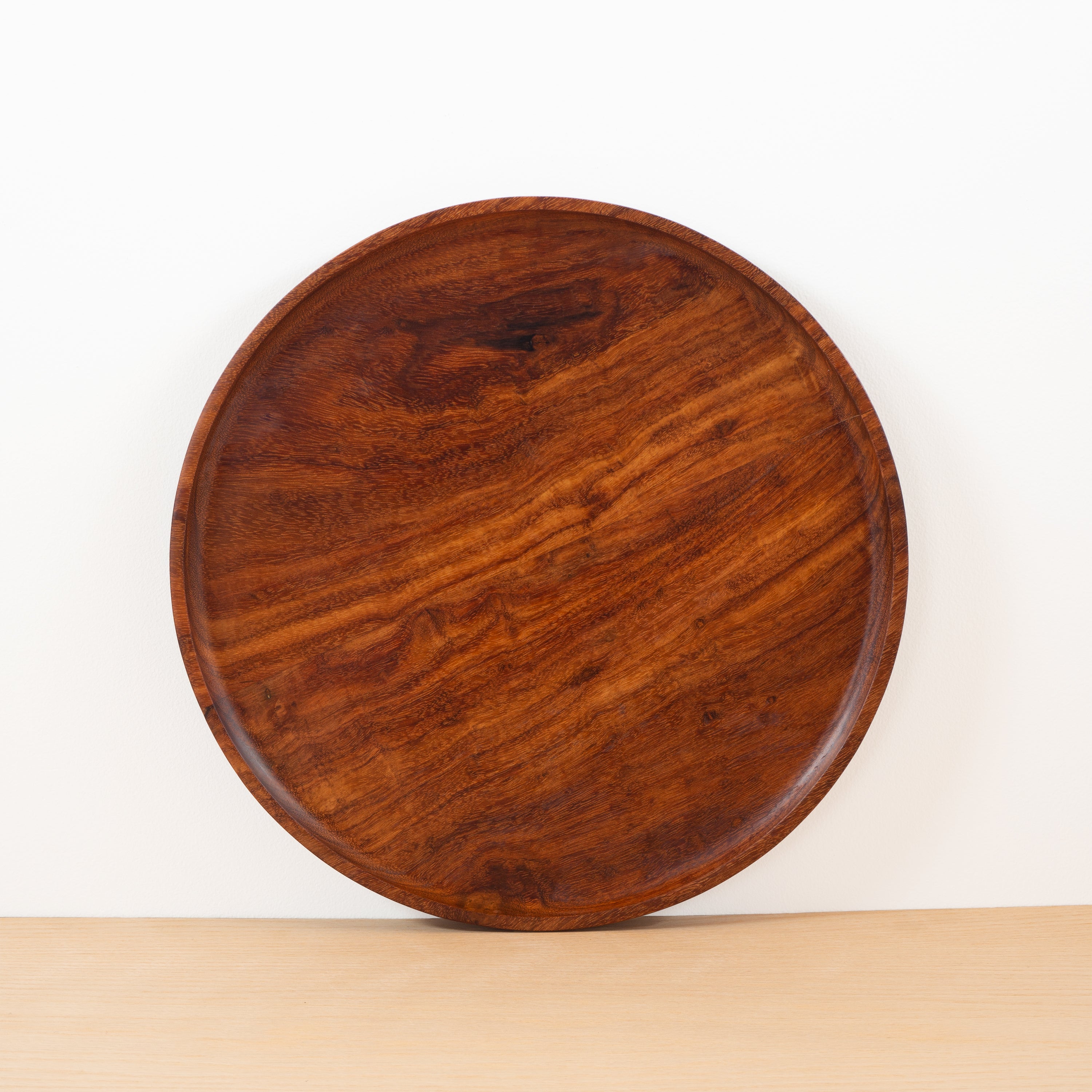 Handcarved granadillo wood round serving platter from the Peten jungle of Guatemala